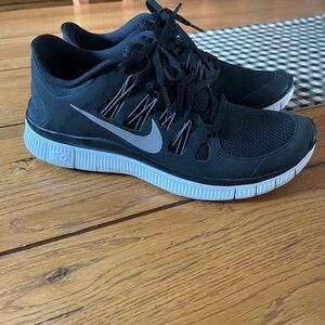 NWOT.  Nike Black  Running Shoes